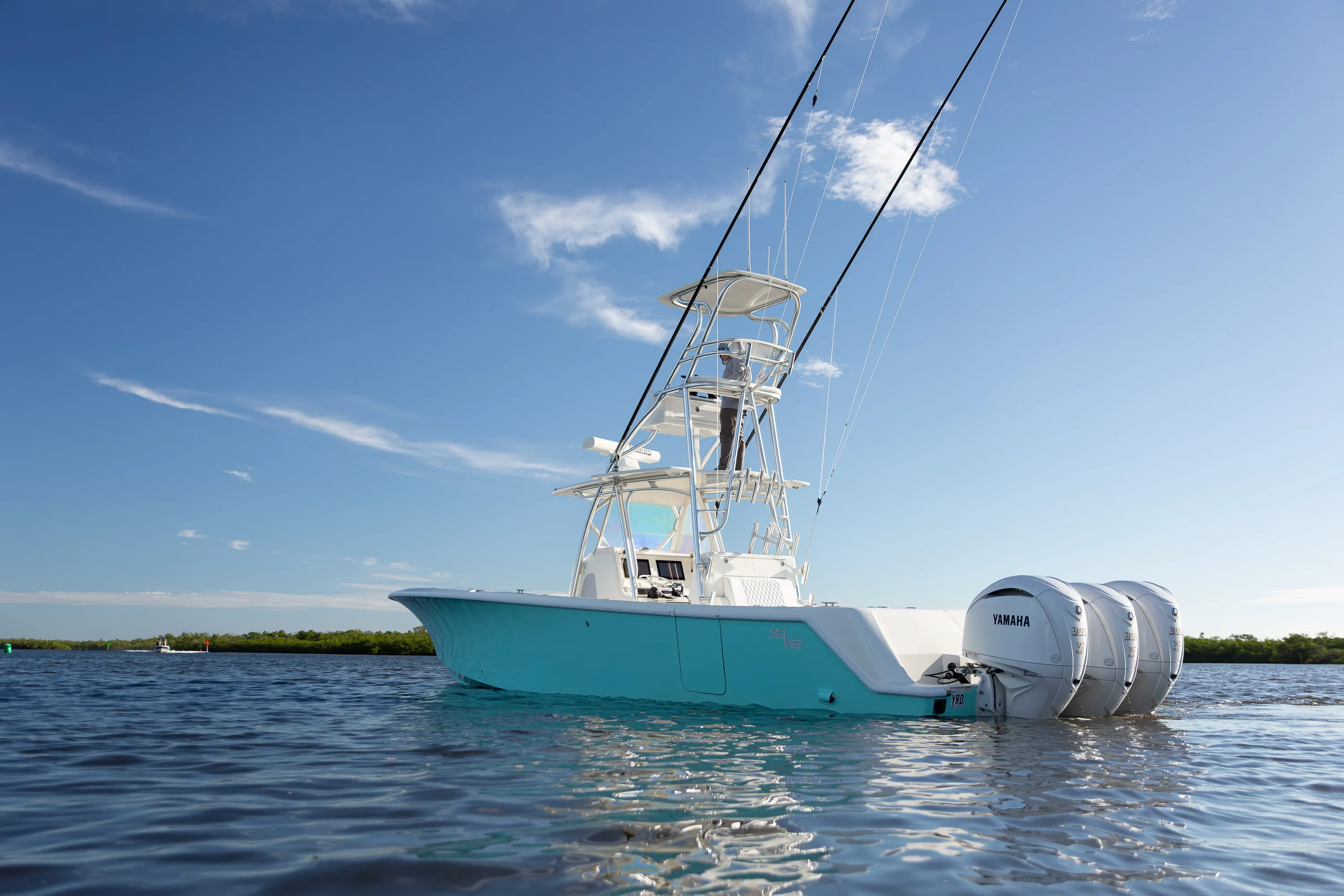 SeaVee 39: stern quarter outboards blue sky